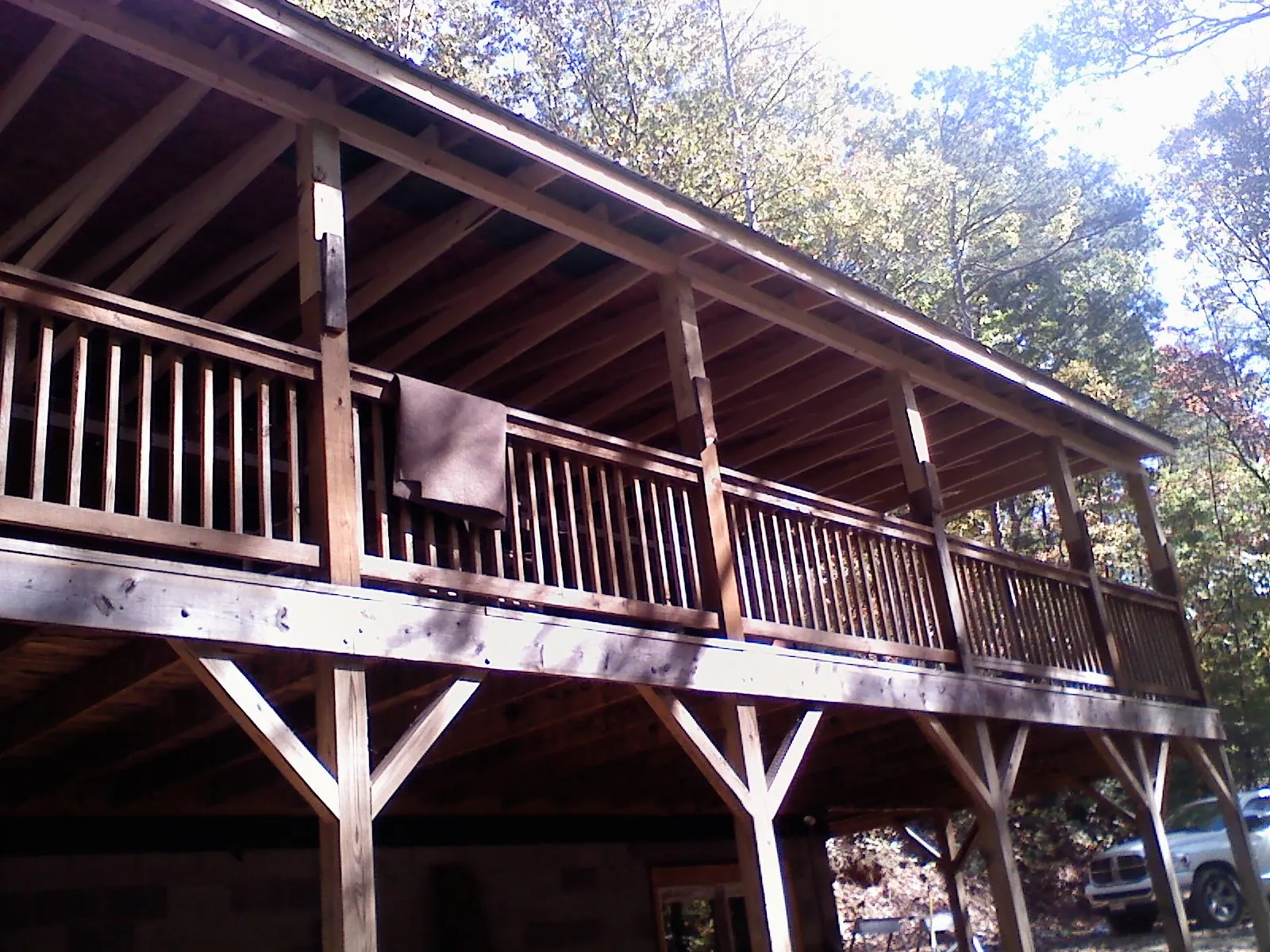 Timber framing under a new elevated porch and deck — Roof Leak Repair in Table Grove by Roofing Brothers